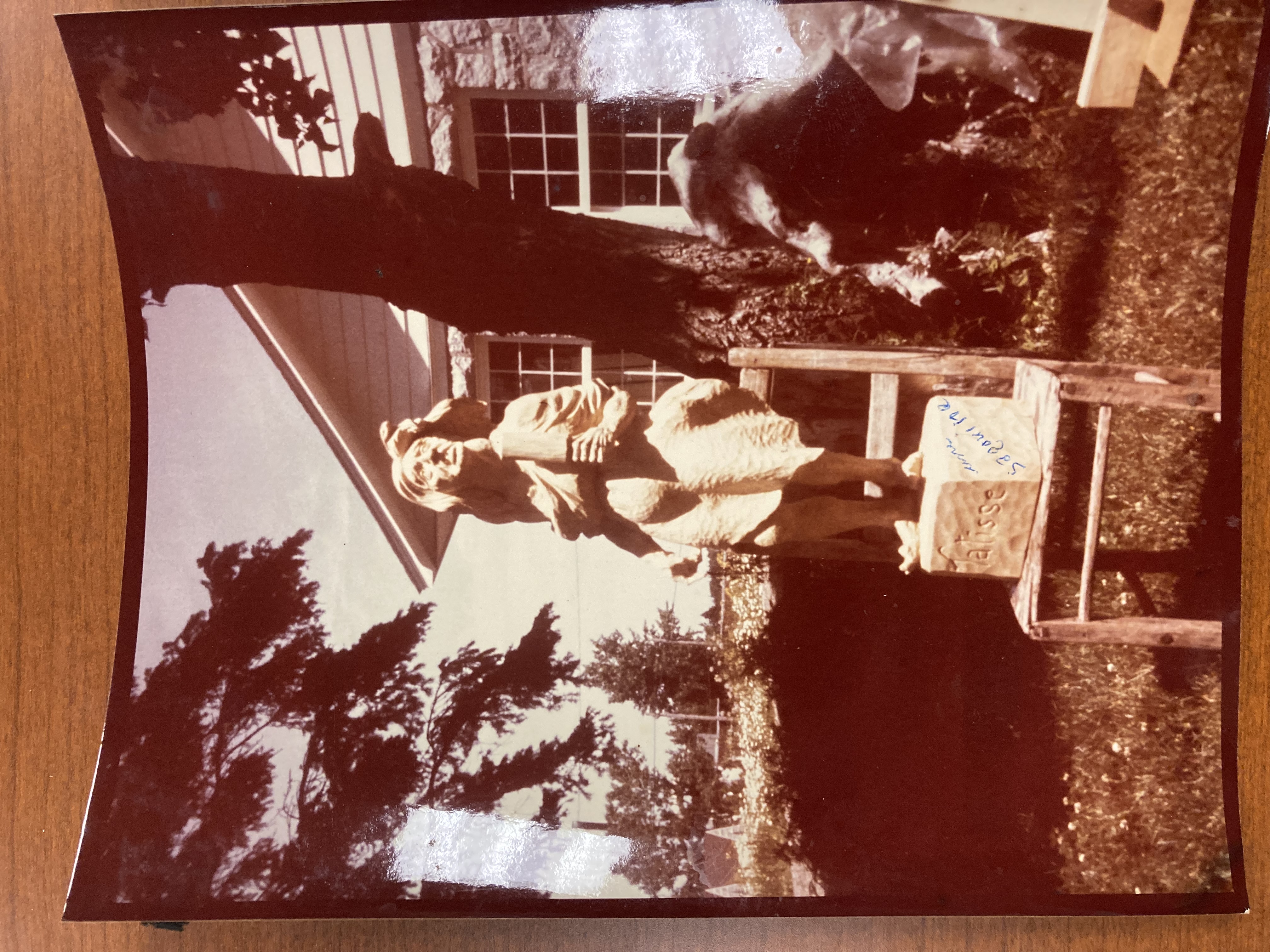 A photo of a large woodcarved statue done by Jean Julien Bourgault